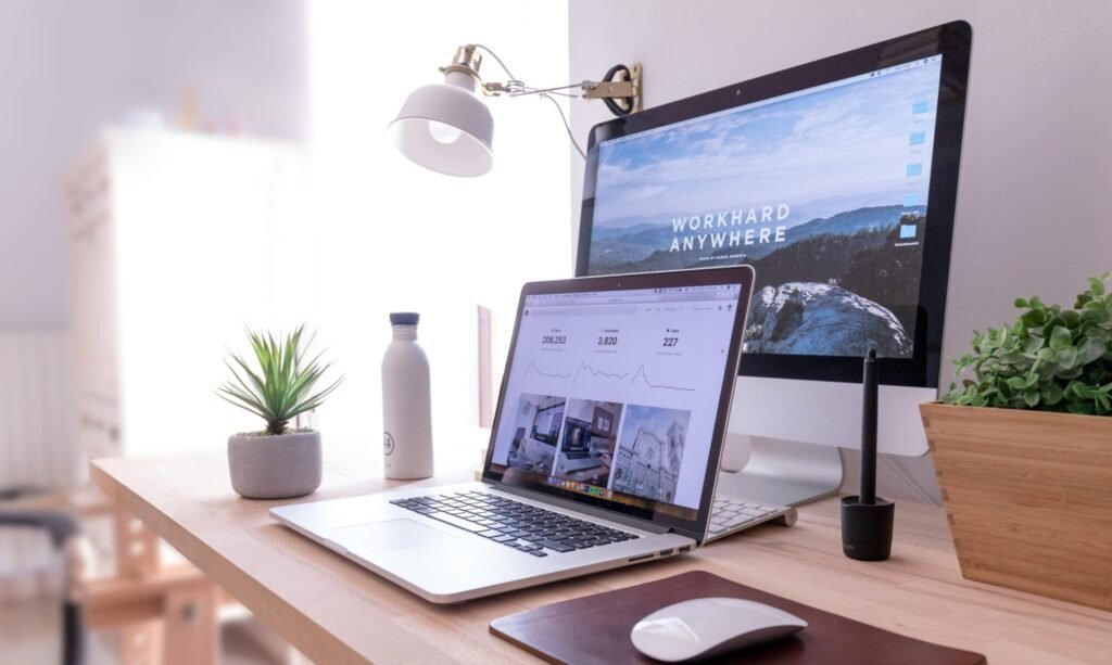 Digital marketing and website design workspace in India with analytics dashboard on screen